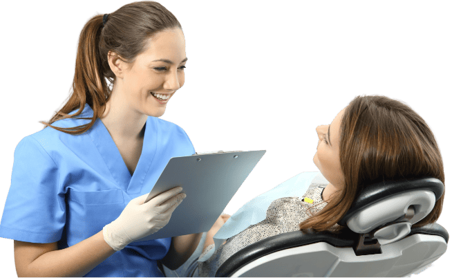 female dentist talking to a patient while she is in the dental chair